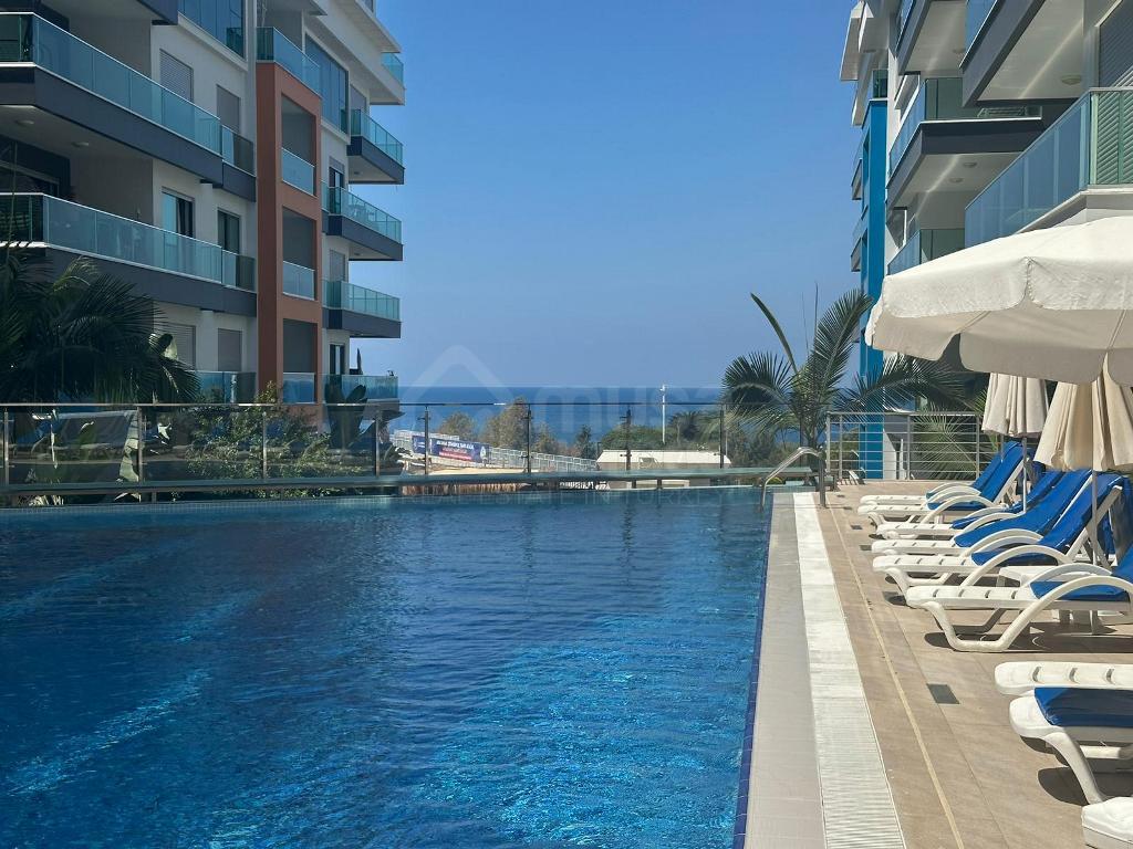 KONAK SEASIDE HOMES Furnished 2+1 apartment in front of the sea in Kargicak id 6665